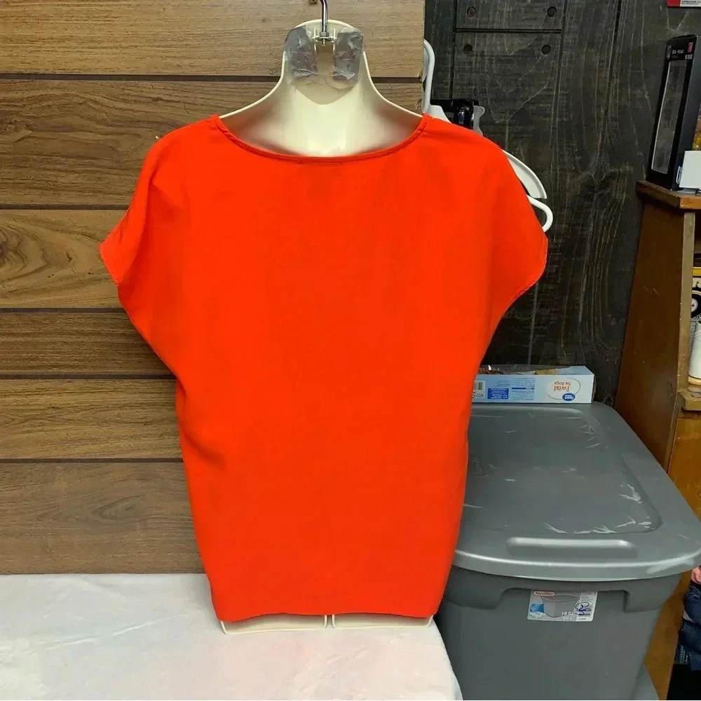 Rachel Zoe bright orange blouse size Small bold seam down the front